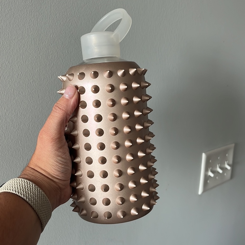 BKR large glass water bottle with gold sleeve